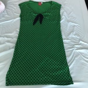 Pinup style green dress with black polka dots